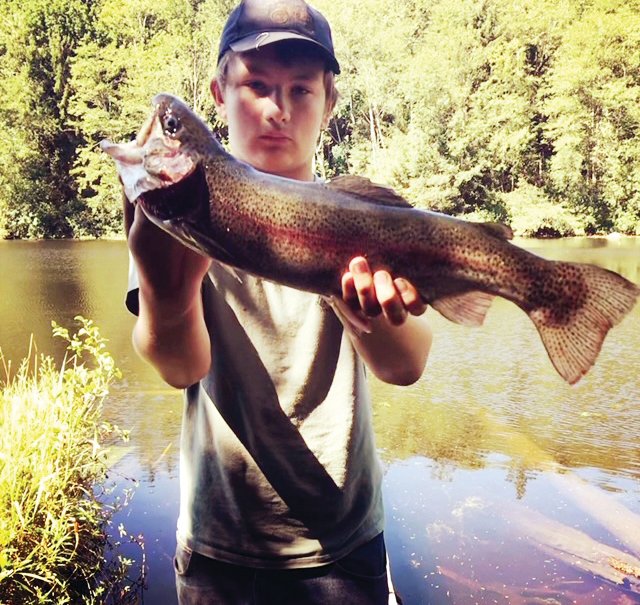 Jasper Bitzer holds the whopper trout he caught at Gibbs Lake.